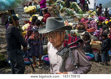 Chichicastenango Guatemala - April 27 2014: Local people in a street market in the town of Chichicastenango in Guatemala