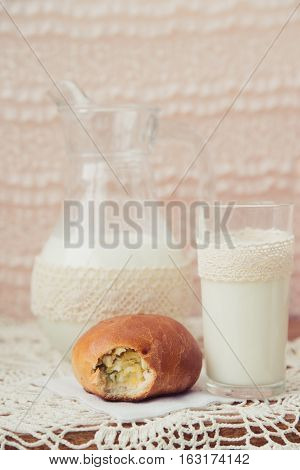 fresh pies with milk on light background
