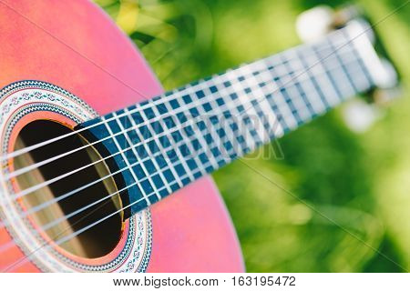 Acoustic guitar bridge and strings close up - macro - very shallow depth of field