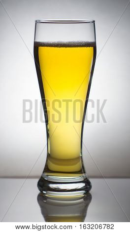 A glass of beer on the white background