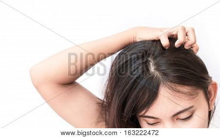 Closeup woman hand itchy scalp Hair care concept