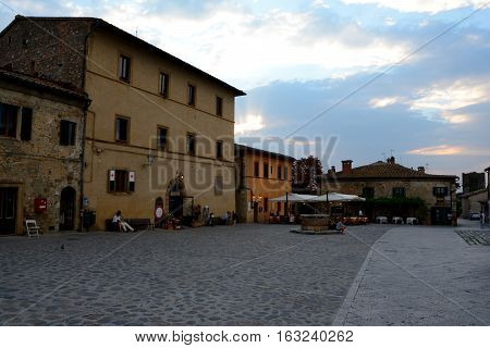 Monteriggioni Italy - September 7 2016: Buildings in Monteriggioni city in Tuscany Italy. Unidentified people visible.