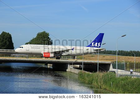 Amsterdam the Netherlands - June 9th 2016: OY-KAO SAS Scandinavian Airlines Airbus A320 taxiing to Polderbaan runway Schiphol destination Copenhagen Denmark