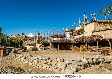 Courtyard in traditional stone build village of Jhong. Annapurna circuit trek in Nepal.