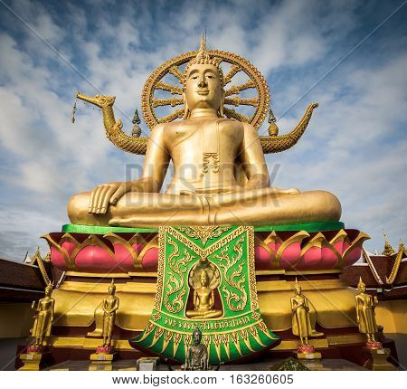 Big Buddha statue at Wat Phra Yai temple with blue sky in the morning on Koh Samui Suratthani Thailand