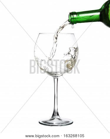 White Wine Pouring From The Bottle Intro The Glass On White Background