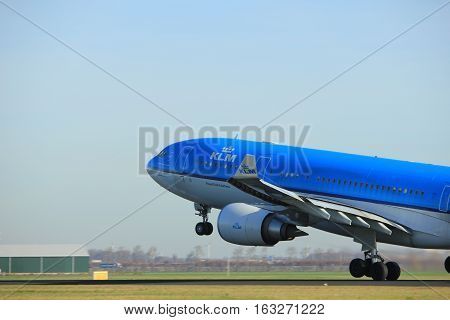 Amsterdam the Netherlands - November 25th 2016: PH-AOM KLM Royal Dutch Airlines Airbus A330 taking off from Polderbaan Runway at Amsterdam Airport Schiphol