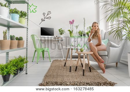 Perfect minimalist workplace with plants, table, chair