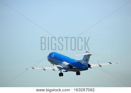 Amsterdam the Netherlands - November 25th 2016: PH-KZE KLM Cityhopper Fokker F70 taking off from Polderbaan Runway at Amsterdam Airport Schiphol