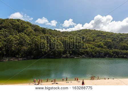 Landscape of people enjoying Lake Wabby in Fraser Island, Queensland, Australia