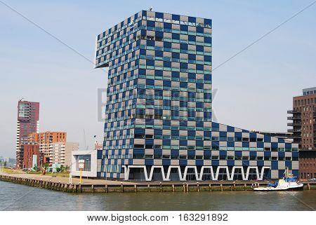 Rotterdam, The Netherlands - July 10, 2014. View of STC Building on Lloydstraat street in Delfshaven district of Rotterdam, with surrounding buildings, river promenade and people.