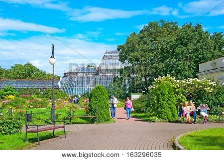 SAINT-PETERSBURG, RUSSIA, AUGUST 3, 2016: People rest in Peter the Great Botanical Garden (Botanic Gardens of the Komarov Botanical Institute of of the Russian Academy of Sciences)