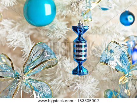 White Christmas tree with blue and white Christmas decorations
