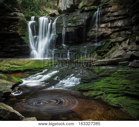 BLACKWATER FALLS STATE PARK, WV/USA - JUNE 30, 2016: A long exposure of Elakala Falls as seen on June 30 in Blackwater Falls State Park. Elakala Falls are known for their swirling pools of water.