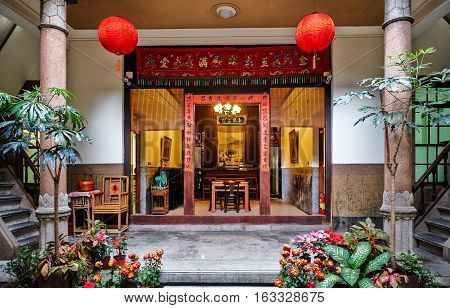 Xiluo, Taiwan - Mar. 12 : Traditional oriental chinese heritage building with spring couplets&red lantern in Taiwan (Chinese Translation on board : home full of wealth and blessing) at Mar. 12, 2016