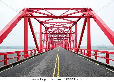 Symmetrical red steel structure construction of bridge and road in Xiluo Taiwan
