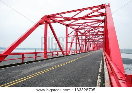 Symmetrical red steel structure construction of bridge and road in Xiluo Taiwan
