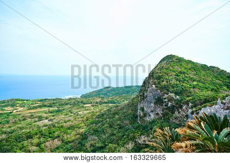 Aerial View of beautiful hill sea level with blue sky in Dai Sekirinzan park Okinawa Japan