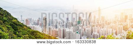 Business concept for real estate and corporate construction - panoramic modern city skyline bird eye aerial view with dramatic sunrise and morning blue sky in Hong Kong (HK) China