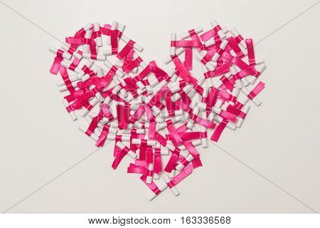Crumbled twisted paper and tied with a pink ribbon