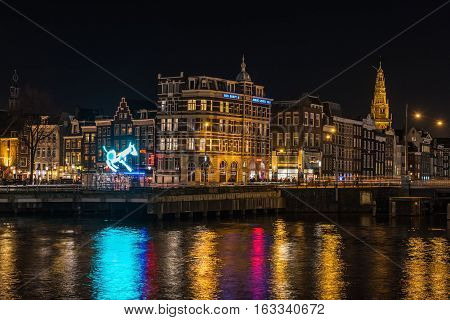 AMSTERDAM, NORTH HOLLAND/THE NETHERLANDS - DECEMBER 3, 2016: Night city view from railway station at Amsterdam Light Festival