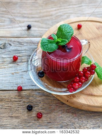 Cup With Berry Kissel And A Sprig Of Mint.