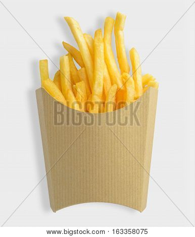 French fries in kraft blank paper box on white background. Clipping path included on white background.
