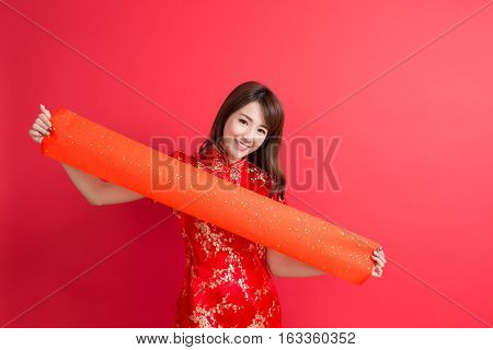 beauty woman wear cheongsam and show couplets with chinese new year