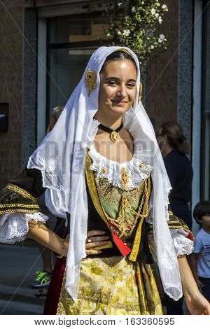 SELARGIUS, ITALY - September 11, 2016: Former marriage Selargino - Sardinia - portrait of a beautiful smiling girl in traditional Sardinian costume