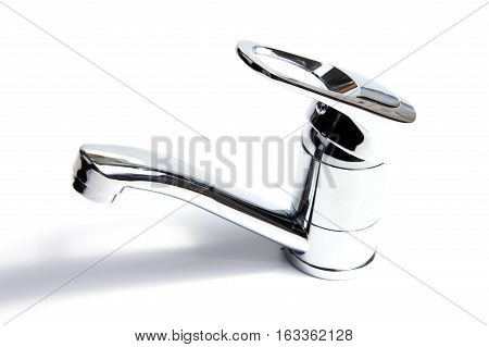 Modern stainless steel tap. Isolated on white background.
