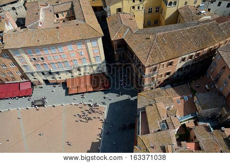 Siena Italy - September 8 2016: Aerial view of Piazza del Campo in medieval Siena city in Tuscany Italy. Unidentified people visible.