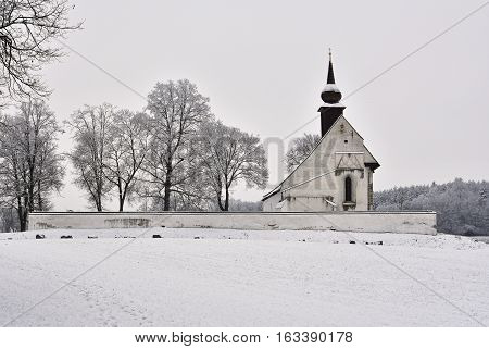 Winter landscape with a beautiful chapel near castle Veveri. Czech Republic city of Brno. The Chapel of the Mother of God.