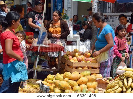 CHICHICASTENANGO GUSTEMALA APRIL 29 2016: Portrait of a Mayan woman saling fruits and vegetables. The Mayan people still make up a majority of the population in Guatemala,