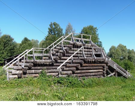 Russia, Great Novgorod, Vitoslavlitsy, slide out grulich dark hardwood logs
