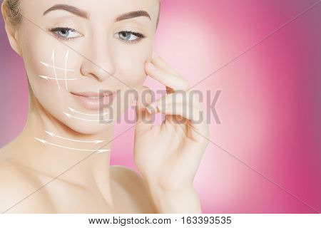 Closeup of female adult with  marks on skin for cosmetic medical procedures