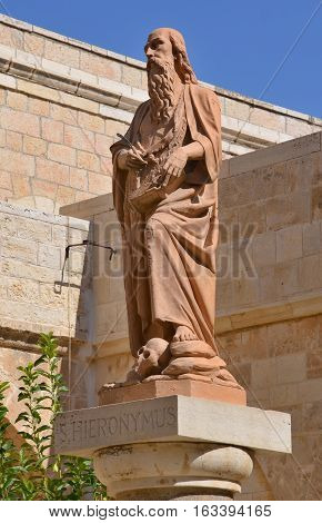 BETHLEHEM ISRAEL 26 10 16: Saint Jerome lived in Bethlehem from about 384 to 420 A.D. In the front of the Church of St. Catherine in Bethlehem there is a modern statue of Jerome showing him.