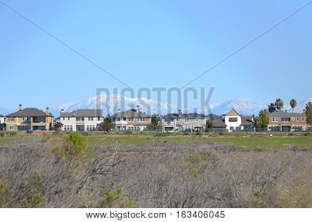 The snow capped San Gabriel Mountains seen from Bolsa Chica Ecological reserve in southern California, approximately 65 mile distance.