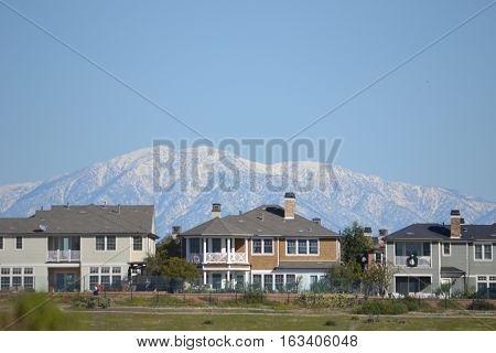 The snow capped San Gabriel Mountains seen from Bolsa Chica Ecological reserve in southern California, approximately 65 mile distance.