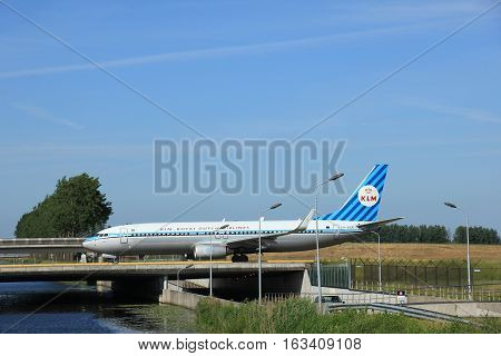 Amsterdam the Netherlands - June 9th 2016: PH-BXA KLM Royal Dutch Airlines Boeing 737 taxiing to Polderbaan runway Schiphol destination Rome Italy. Retro livery for KLM 90th anniversary
