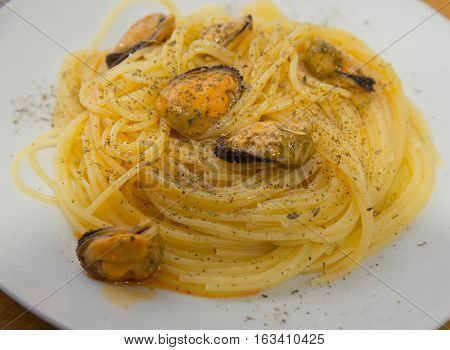 Pasta With Mussels And Herbs On The Plate