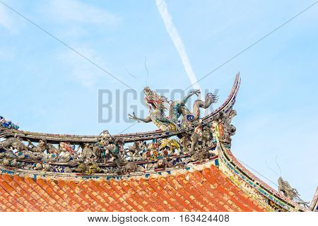 Asia culture concept - Roof with beautiful decoration of famous heritage landmark the traditional old oriental Chinese temple lungshan in Taipei Taiwan