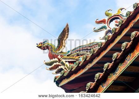 Asia culture concept - Roof with beautiful decoration of famous heritage landmark the traditional old oriental Chinese temple lungshan in Taipei Taiwan