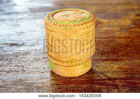 Kratib sticky rice placed on the old wooden table.