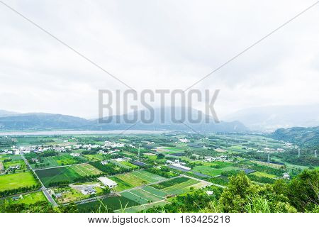 Panoramic bird eye aerial view of beautiful field and mountain under fantasy cloudy sky in Luyeh Hill Taitung the famous attractions in Taiwan