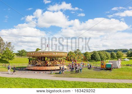 BEAMISH UK - JULY 27 2012: Built in 1893, the Steam Gallopers are a fine example of the carousels of the heyday of fairs. Powered by a steam and given music by a Gavioli organ the Gallopers are situated at Beamish Museum in North East England.