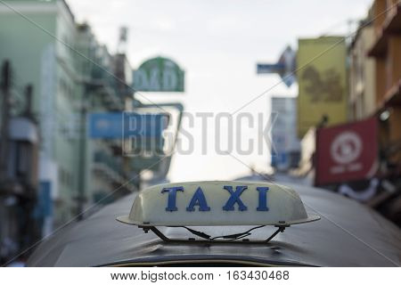 BANGKOK THAILAND - DEC 24 : taxi cab on top of tuktuk car in Khao San road on december 24 2016. tuktuk is popular server for tourist in Bangkok.