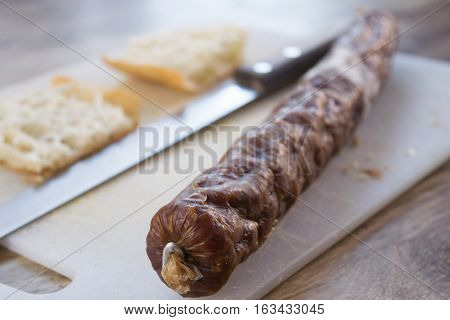 white flat bread filling with hot salami