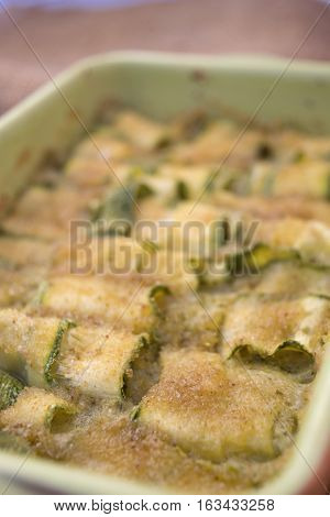 layer of zucchini gratinéed in oven with breadcrumbs