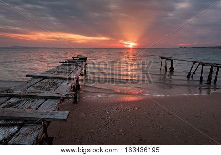 Magnificent sunset with clouds and fire sun in the middle of December, at the village of Ravda, Bulgaria