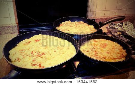 Pots With The Typical Dish Called Frico Of The Italian Region Of
